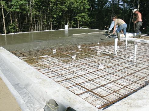 Steel rebar and wire mesh were supported on dobies cut from insulation scraps.
