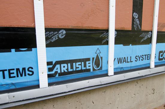 Rainscreen gap created by Cor-A-Plast battens with a folded over insect screen at the bottom. Ready for siding.