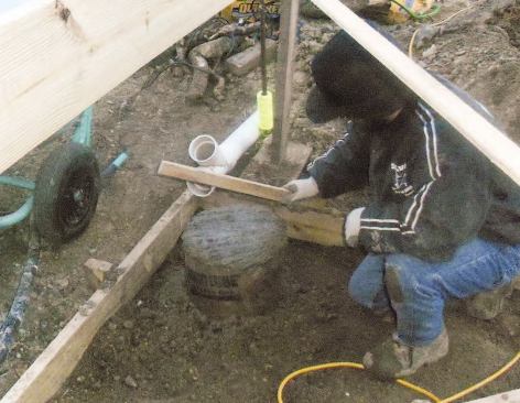 After placing the last of the concrete, I let it set for a few minutes, then tap the top surface with a straightedge to help push down any aggregate.