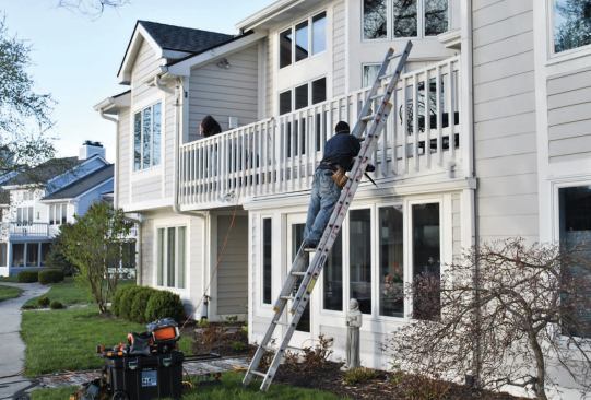 Roof repairs are completed on a second-story pocket deck that leaked heavily during rainstorms.