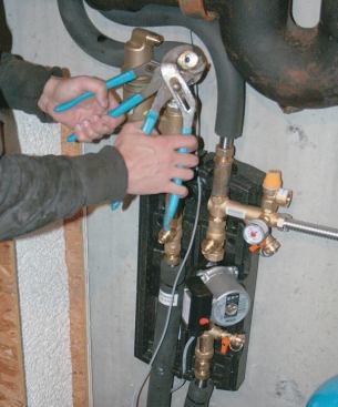 Connections were made at the manifold assembly, which includes a pump, gauges, and controls.
