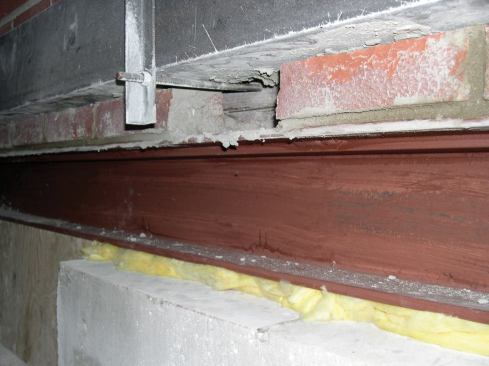 Before removing the temporary lintel, the missing course of brick was relaid.