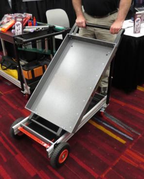 Opening the cart is a matter of lifting one side at a time to the upright position and engaging the legs with spring-loaded locks.