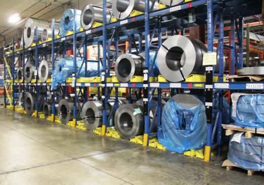 The steel and aluminium used in Knaack and Weather Guard boxes arrives at the plant in coils and is stored until needed. At that point it is rolled flat and cut to shape prior to bending.