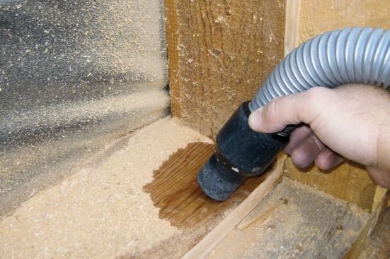 Once the jambs are cut, we immediately clean up with the vacuum.