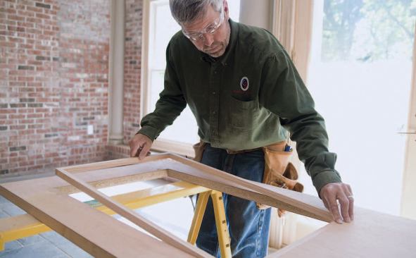 Split jambs that fit snugly in the opening hold the glass in place.