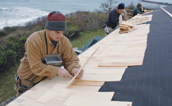 On a typical job, each carpenter works a section of the roof, which helps avoid confusion; courses are checked regularly and adjusted as needed.