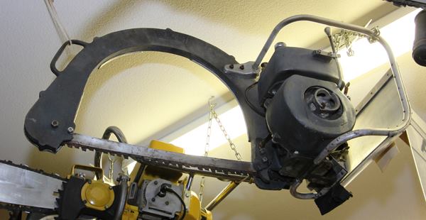 Common in Europe, bow-shaped chainsaws are rare in North America. They are typically used for bucking logs and lumber.