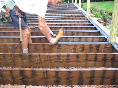 Prior to installation of the new decking, strips of flexible flashing tape were stapled to the tops of the framing to protect the wood from water and debris.