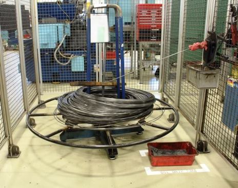 This coil of steel is being fed into machines that will straighten it, cut it, and begin the process of turning it into a screwdriver shaft. That red rag on the right is kind of funny. It’s there to prevent any oil or debris that is on the steel from getting into the machine. The fellow who was giving me the tour wanted to take it off before I took the photo because he was embarrassed to be using it. I told him not to bother, that it was a clever fix – the kind any tradesman might make on the jobsite. It’s not like you can order a factory out of a catalog; every factory is custom-built and is a work in progress.