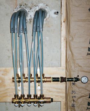The piping for the snowmelt loops originates at a manifold in the basement or boiler room.