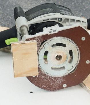 A small scrap of plywood hot-glued to the base helped the router stay square to the template.