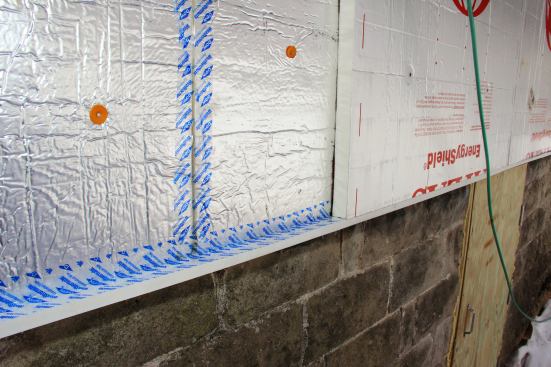 A closer view of the foam installation detail shows the inner layer of foam, sealed with Dow Weathermate tape, topped with a second layer of 1.5-inch foam.