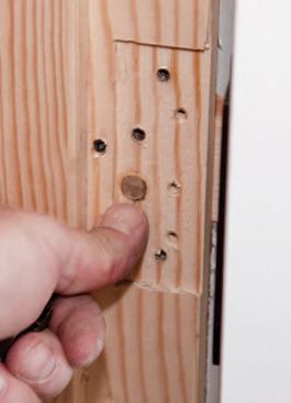 He glues the plug in place with a fast-setting two-part adhesive.