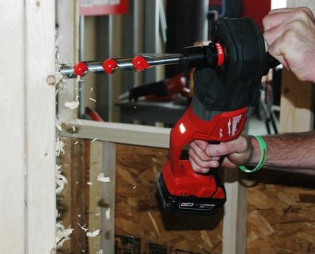 M18 FUEL Hole Hawg. This heavy duty right-angle drill was one of the most exciting new tools at the event. With its high-rpm gearing this drill is intended for electricians; a geared-down version (capable of cranking 4 5/8-inch self-feeding bits) for plumbers is on the way. 
Click here to see a new cordless Hole Hawg in action. The tool is available in two 
configurations, with a 1/2-inch chuck (model 2708) and with a snap-in bit holder that takes the 7/16-inch hexagonal shanks common on self-feeding bits. Available: October 2014. Price: $280 (tool only)