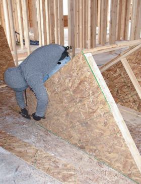 Squaring Up: Toenailing it to the deck kept it from shifting around as we worked on it.