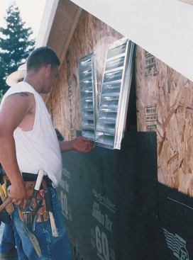 Flashing details frequently involve the interaction of two trades. Here, for example, the stucco crew members responsible for installing the building paper had to remove and reinsert a gable vent installed by the framers so that they could run building paper under the vent flange.