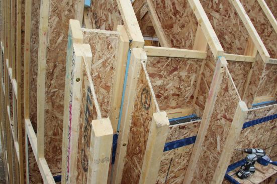 A view of the wall corner cavity, formed by an assembly of wood I-joists. The vertical insulation cavity here, once dense-blown with cellulose, will virtually eliminate thermal bridging at the wall intersection (a key consideration in Passive House construction methods).