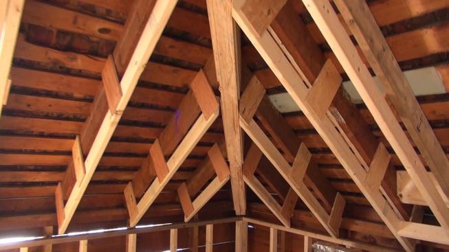 Another view of the roof build-down, constructed so as to provide additional space for spray polyurethane and dense-blown cellulose insulation. The hip rafter here has also been supported with new LVLs.