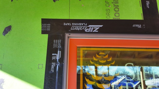 These clad vinyl-frame windows have an integral flange.