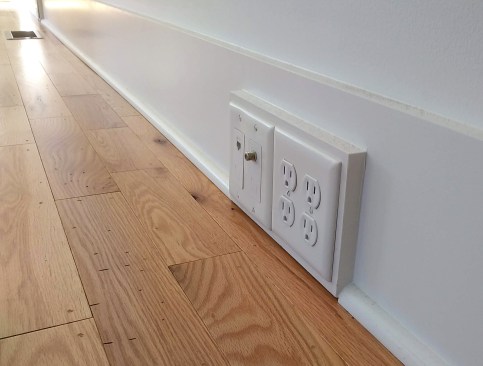 Surface-mount outlets, cable, and Ethernet can be integrated with baseboard.
