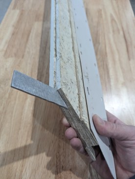 ... an aluminum L-bracket fits tightly into the kerf  to align the two sides of the miter and hold it together.
