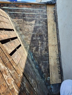 Reroof. The author’s crew removed the brick ledge, sheathing over this area.