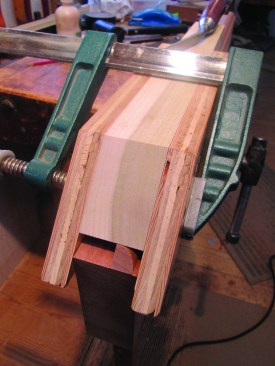 To fine-tune the jack miters, the author makes a “shooting block,” which serves as a guide for a back bent chisel. The plywood sides of the shooting block register exactly with the very end of each rail. (On the stiles, the plywood sides register with the layout lines that mark the exact end of the shoulder.)