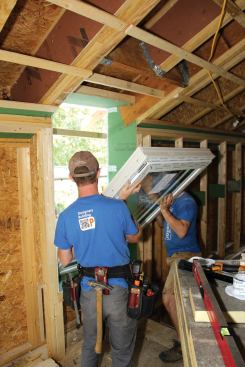 Inside the house, each window is lifted into the opening and positioned tightly against the 2x3 rails ...