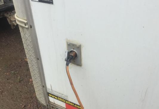 The trailer has RV plugs on either side, which can be connected an AC power source or generator. The interior of the trailer is wired with 12-gauge wire in plastic conduit.