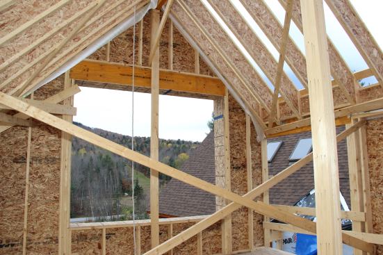A south-facing window in the addition’s main room opens a view of the ski slope on the hill to the south.