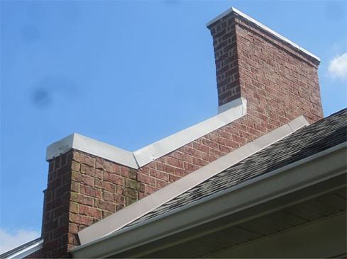 This may be a firewall between adjacent housing units, but all I see is a reservoir to let water come in between those two units through the brick. Unfortunately, this is typical of what you get nowadays, and it flies in the face of building tradition.