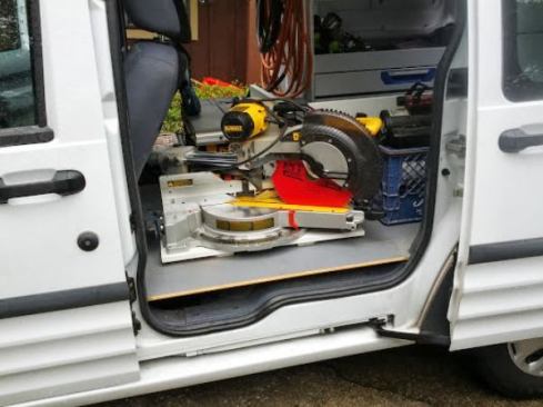 The gray material on the floor is some kind of embossed 1/2-inch plywood. It was there when I bought the van and I’m not sure whether it is stock for the cargo model or some kind of aftermarket accessory.
