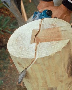 After the pockets for the beams are cut, the tops of the posts are beveled so that they shed water.