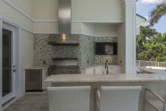 Essential to any waterfront property is a fully functional kitchen and gathering space for outdoor entertainment. To ensure a long life, 41 West used a waterproof resin for the countertops.   