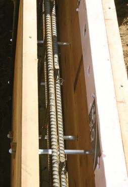 For stem walls, the author uses 2x10s with form ties that also support rebar.