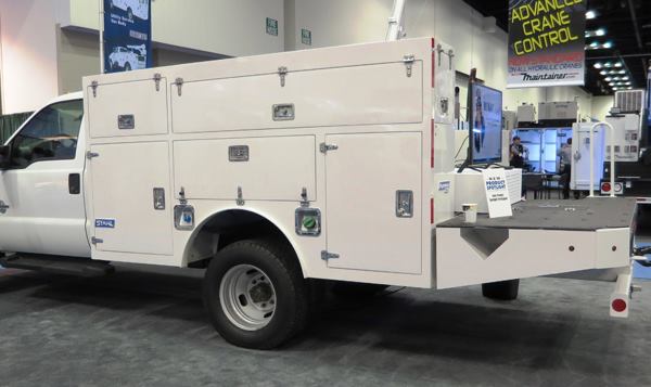 Most service bodies are made from steel, aluminum, or fiberglass. Stahl’s Razorback service body is made from high impact polypropylene—and that’s a first for the industry. Lighter than a steel body, it allows for better fuel economy and larger payloads. Supposedly, you could hit the thing with a hammer and the hammer would bounce off without leaving a dent. Available in black or white, it would be painted to match the vehicle. If the vehicle is black or white, then scratches won’t show. The other construction details are as one would find on any high-quality service body: stainless steel hardware, gasketed doors, and the like.