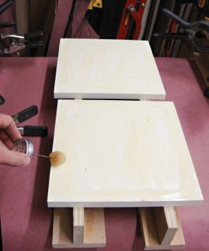 While the cement on the columns was drying, the authors set up another gluing station for the caps and bases.