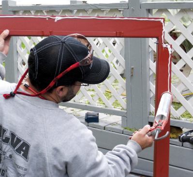 Installing the Access Cover: Before installing the door unit, I always do a dry fit, just in case. There were no problems with this one, so after running a thick bead of caulking along the sides and top of the metal frame, I set it in place. I don't caulk the bottom in case any water needs to drain out. When you adjust these units for square, it's important to have both doors on so that you end up with an equal space between them.