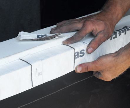 I double up 2-inch strips of peel-and-stick, using them as drainage spacers; if any water gets into the opening, this will allow it to drain.