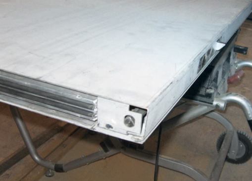 Adjustable flush bolts at the top and bottom of the passive door are activated by a lever mechanism in the edge of the door.