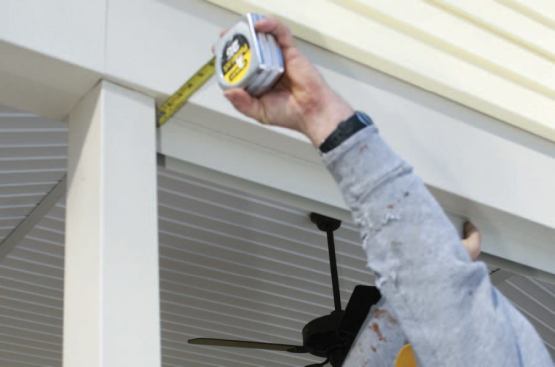 We carefully measure to make sure the panels will be plumb.