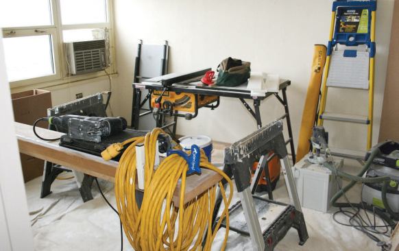 An unoccupied apartment was converted into the project's field office, with a workshop in the bedroom.