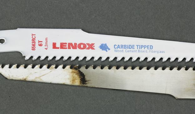 Lenox's carbide-toothed blade may not cut nails, but it's great in abrasive material. The blade at the bottom was still going strong after making 122 cuts through shingles and OSB. The tips were worn but not damaged.