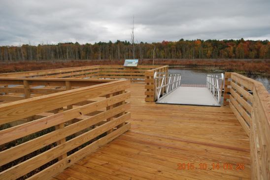 The rail system consists of 2x6s  face-nailed to the posts, and a continuous 2x6 top rail. A 7-ft. wide aluminum gangplank leads to the floating boat launch.