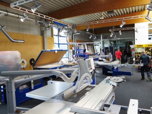 Room number three also contains stationary equipment, including sliding table saws, edge banders, and a vacuum press (the thing that looks like an old fashioned chest freezer with the lid open).