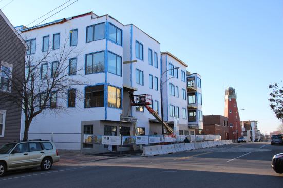 Nearby in Portland, crews are drying in a four-story mixed-use building at the top of Munjoy Hill. In the background, morning sunshine gleams off the window of the Portland Observatory (built in 1807), the last surviving maritime signal tower in the United States. Convenient to downtown and well-supplied with local shopping and restaurants, the Munjoy Hill neighborhood has thrived in recent years.