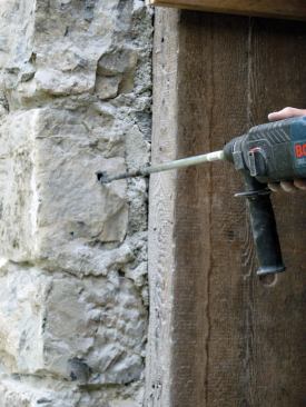 To ensure a good bond, the author cleaned the hole with a wire brush.