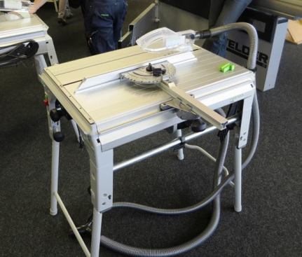 This is one of the smaller, more portable, Festool table saws at the store. The gizmo that holds the fence can be used for ripping or to set angles when the machine is being used as a pull-saw. In that mode, the material remains stationary and the blade is pulled towards the front of the table to cut it. This configuration is common in Europe; it’s akin to using a radial arm saw where the blade is under rather than over the table.