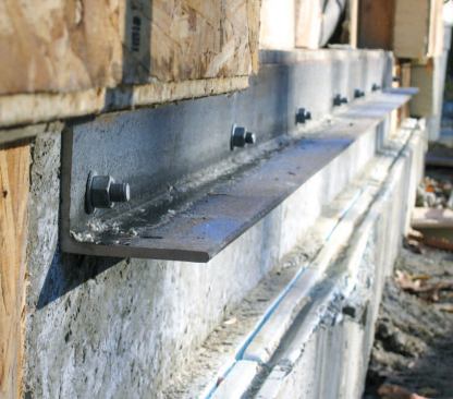 Steel angle bolted in place.